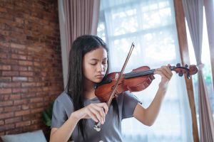 Asian girl playing violin